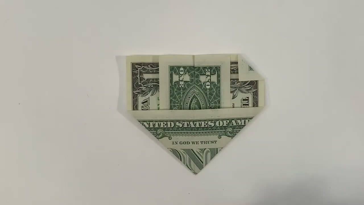 Step 5: Turn the Bill Over and Fold the First Corner Down - How to Fold Money Into a Heart