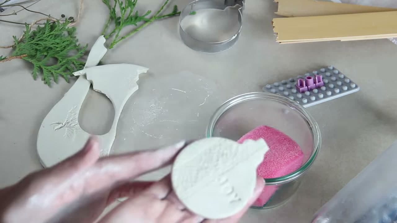 Step 6: Smooth the Cut Edges With a Damp Fingertip - How to Make Air Dry Clay Ornaments for Christmas