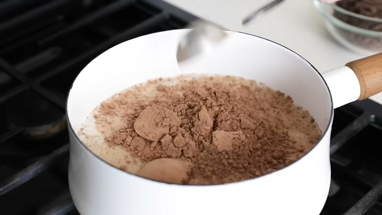 Step 3: Add 3 Tablespoons of Cocoa Powder to the Milk - How to Make Hot Chocolate