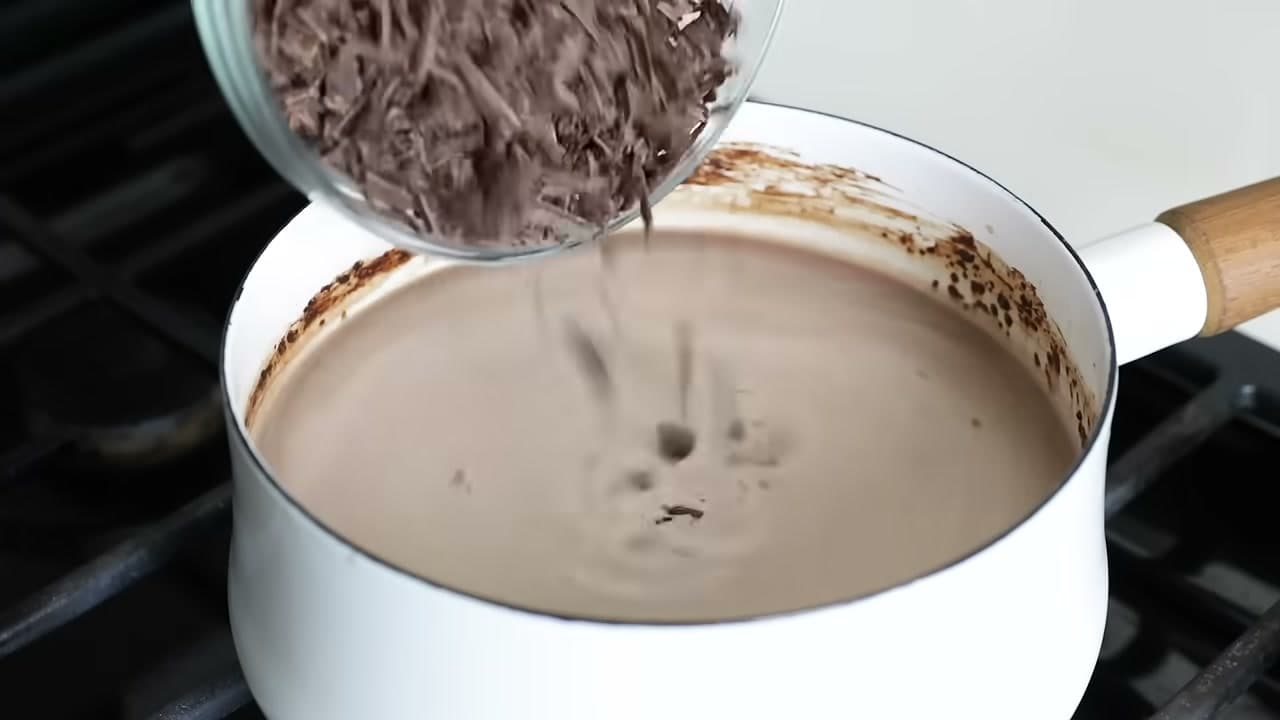 Step 6: Stir the Chopped Chocolate Into the Simmering Milk - How to Make Hot Chocolate