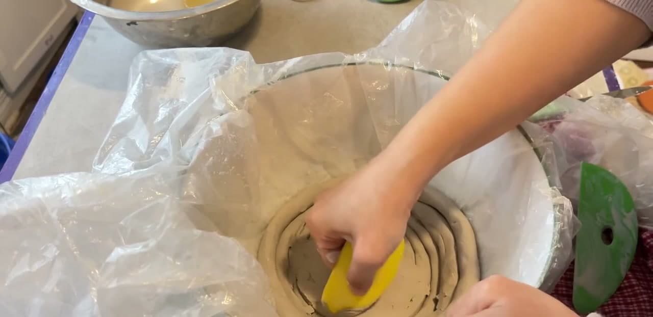 Step 6: Smooth the Inside With a Rib - How to Make a Coil Pot