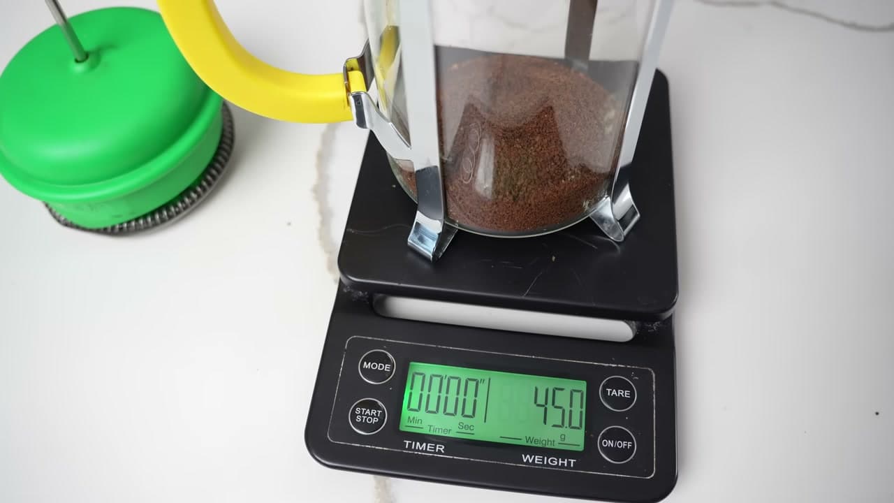Step 5: Add the Grounds and Start the Timer - How to Use a French Press