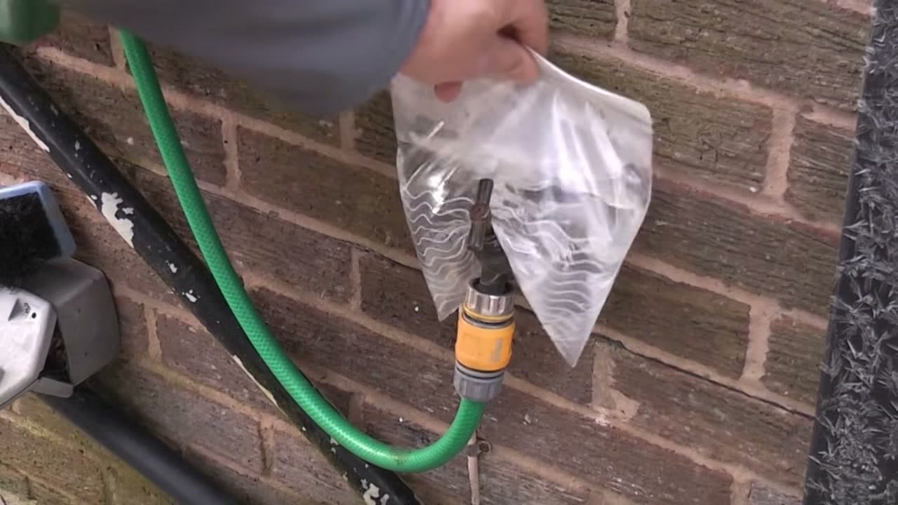 Step 2: Drape the Hot Bag Over the Frozen Outdoor Spigot - How to Thaw Frozen Pipes