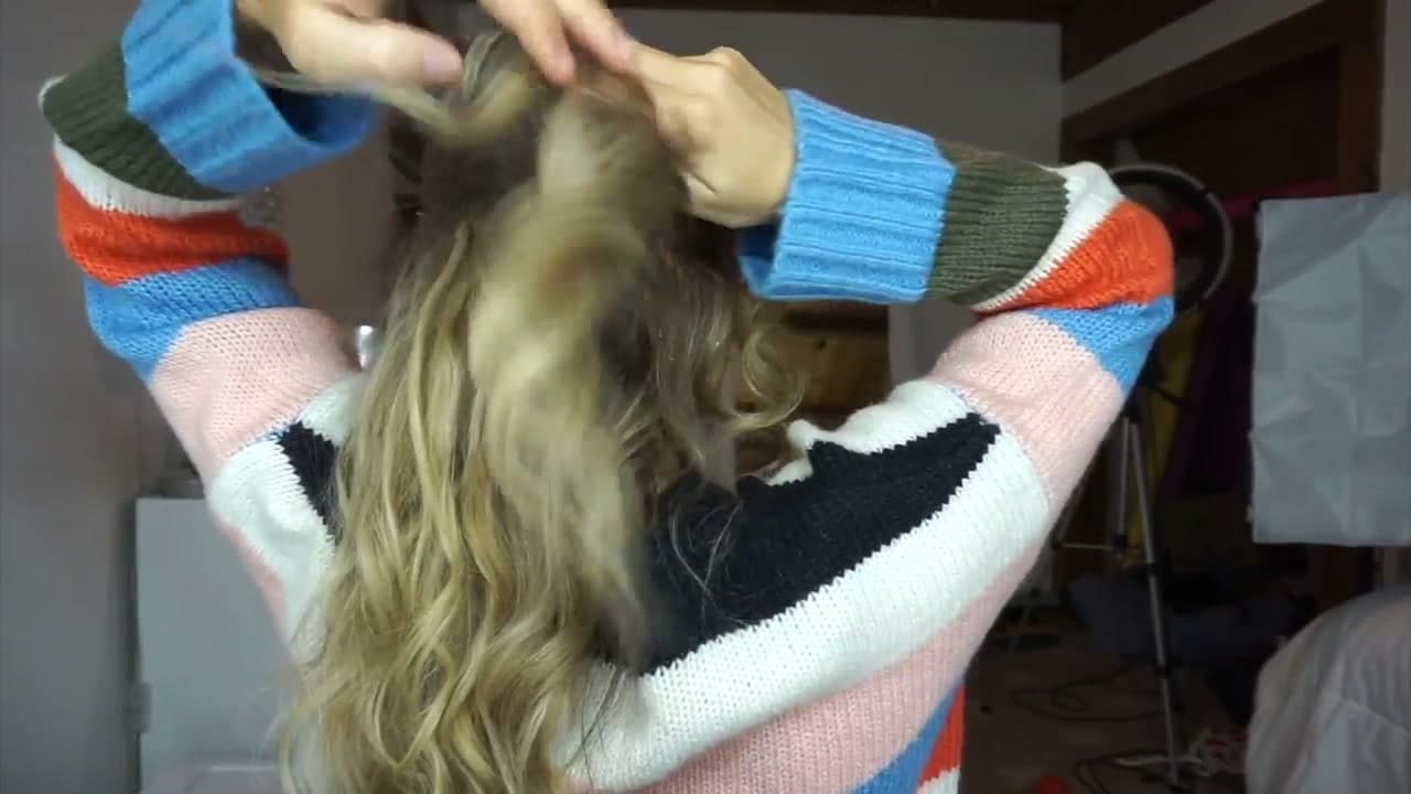 Step 6: Twist a Side Section Across the Poof