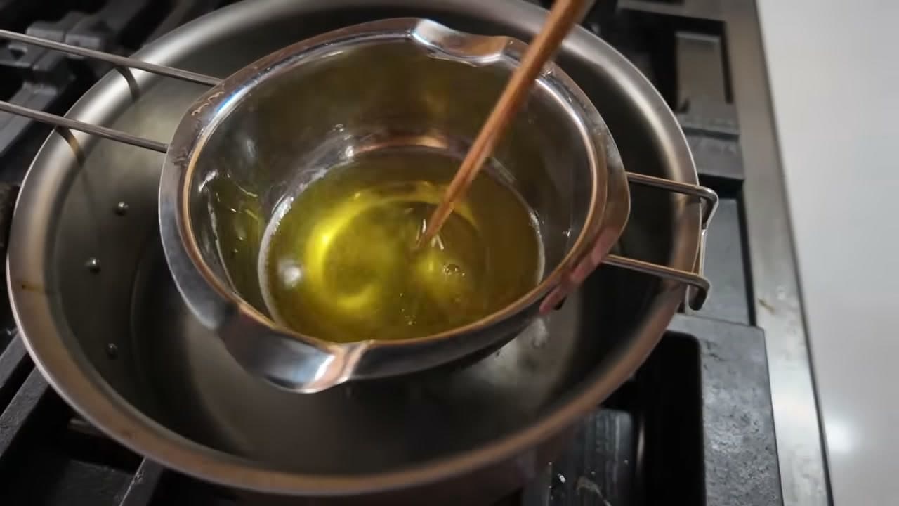 Step 4: Stir Until the Wax and Butters Melt Into Clear Gold - How to Make Lip Balm