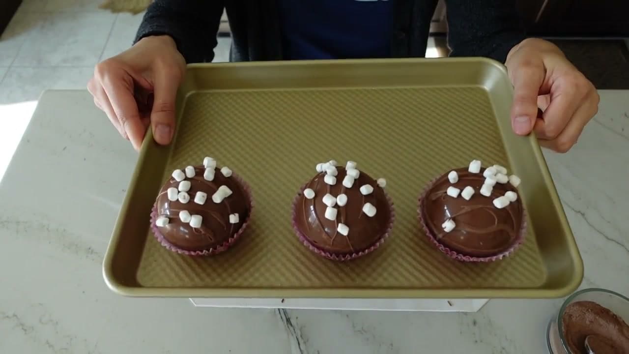 Step 8: Drizzle the Tops and Set Each Bomb in a Cupcake Liner - Hot Cocoa Bomb Recipe: How to Make Them at Home