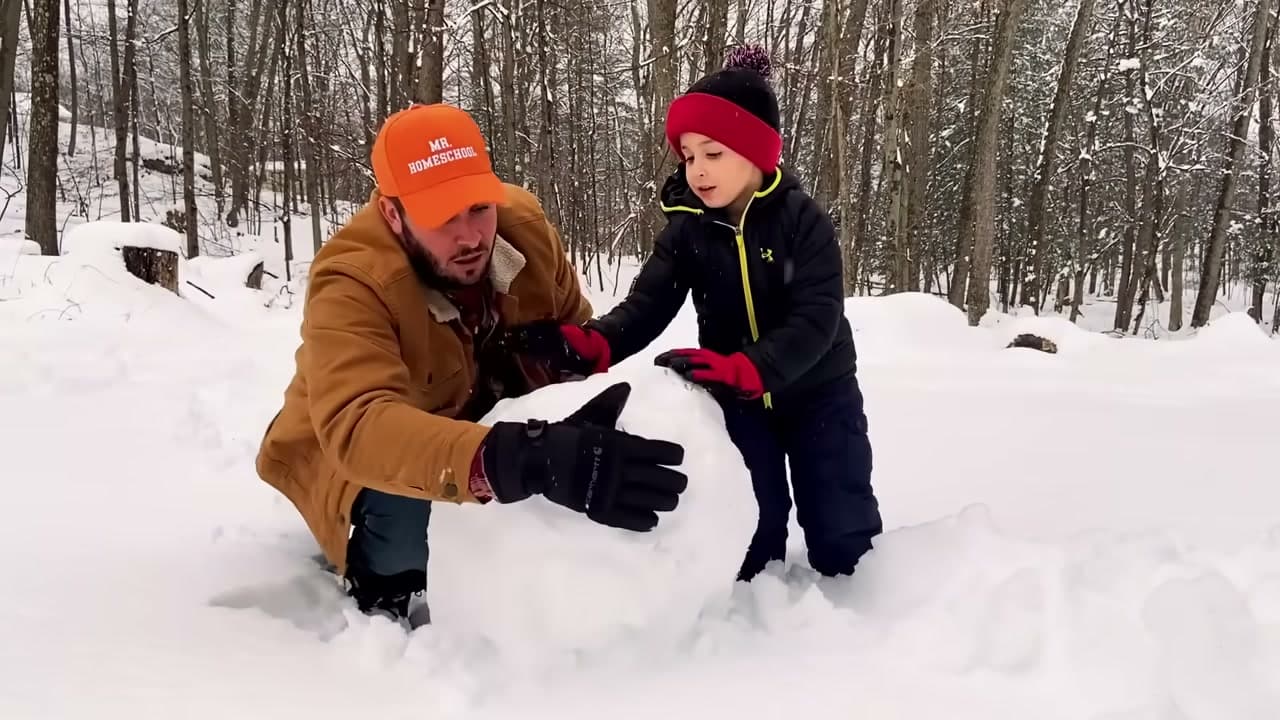 Step 2: Round Off the Bottom Snowball and Set the Base - How to Make a Snowman