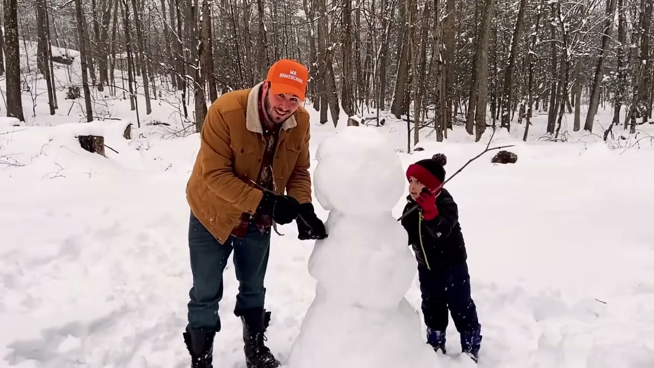 Step 6: Push Two Stick Arms Into the Snowman - How to Make a Snowman
