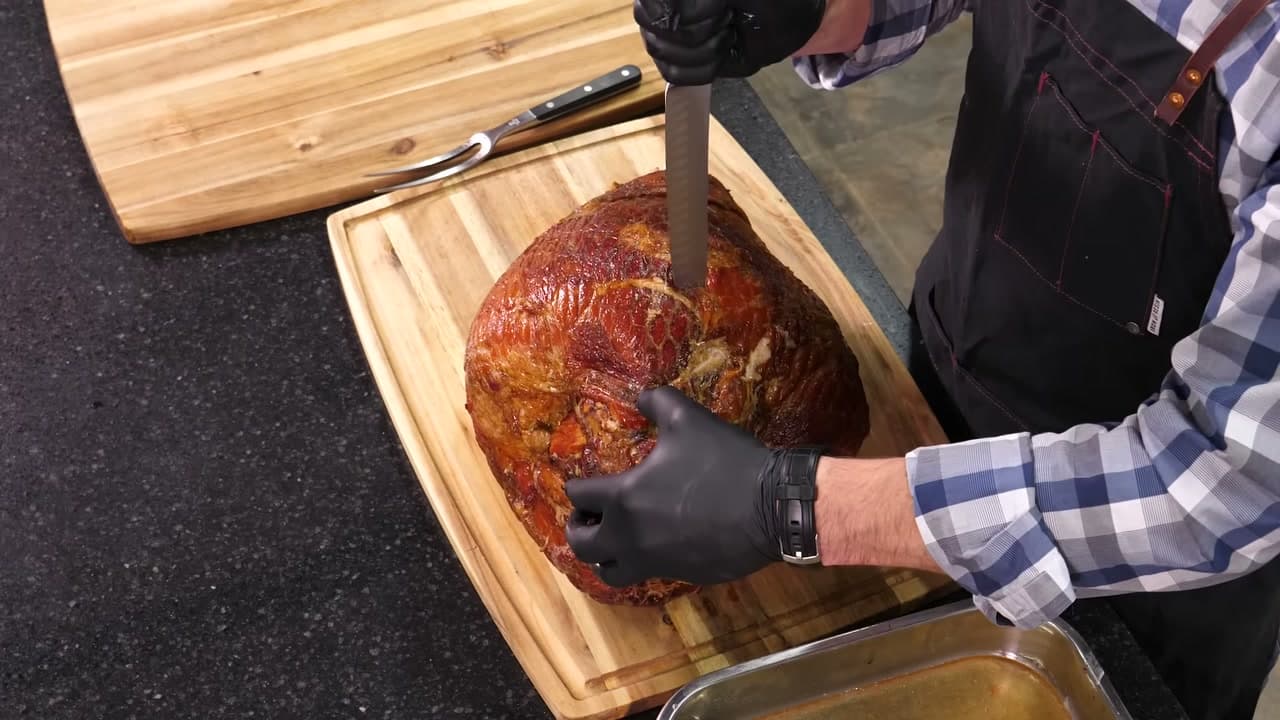 Step 1: Press the Knife Into the Ham to Find the Bone - How to Carve a Ham