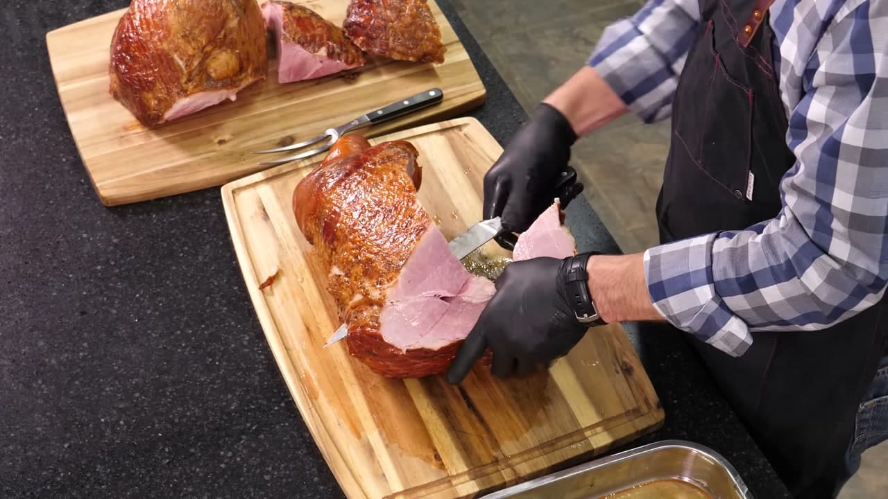 Step 4: Work the Knife Around the Bone for the Next Piece - How to Carve a Ham