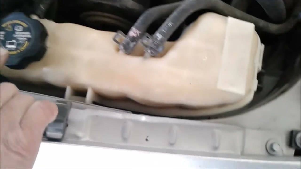 Step 2: Step 2: Pop the Hood and Find the Coolant Reservoir