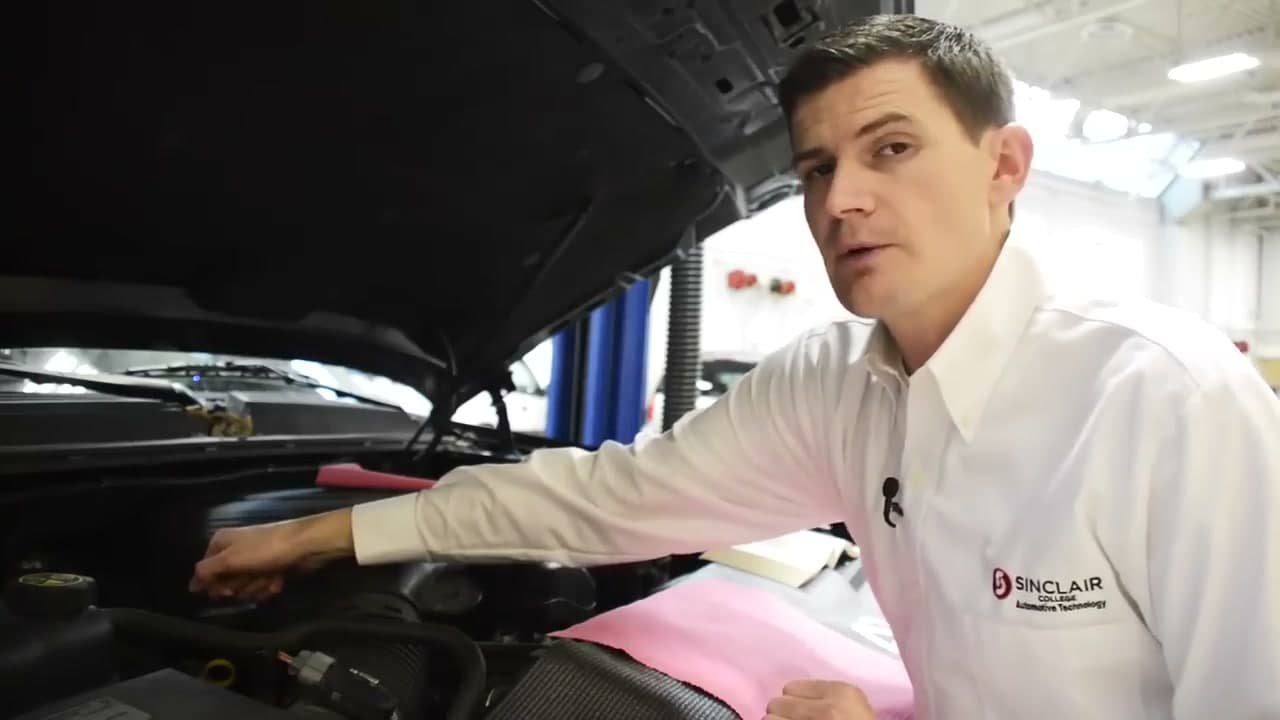 Step 2: Step 2: Pop the Hood and Find the Yellow Dipstick Loop