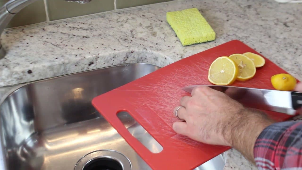 Step 1: Step 1: Cut a lemon into half-moons and feed them down the disposal