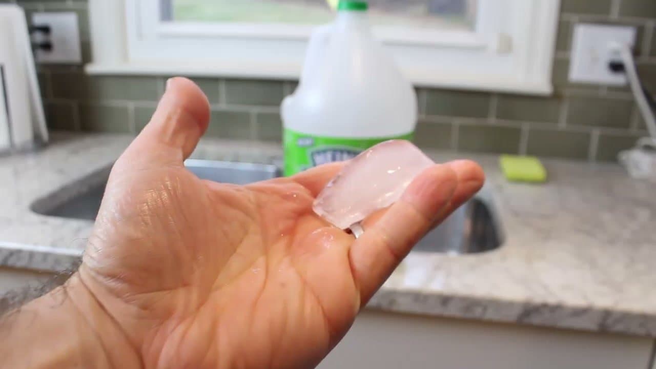 Step 3: Step 3: Drop vinegar ice cubes into the disposal and grind