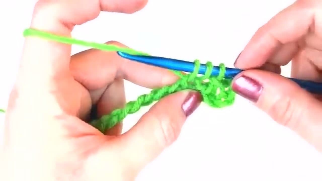 Step 5: Step 5: Yarn over twice more, finish the stitch
