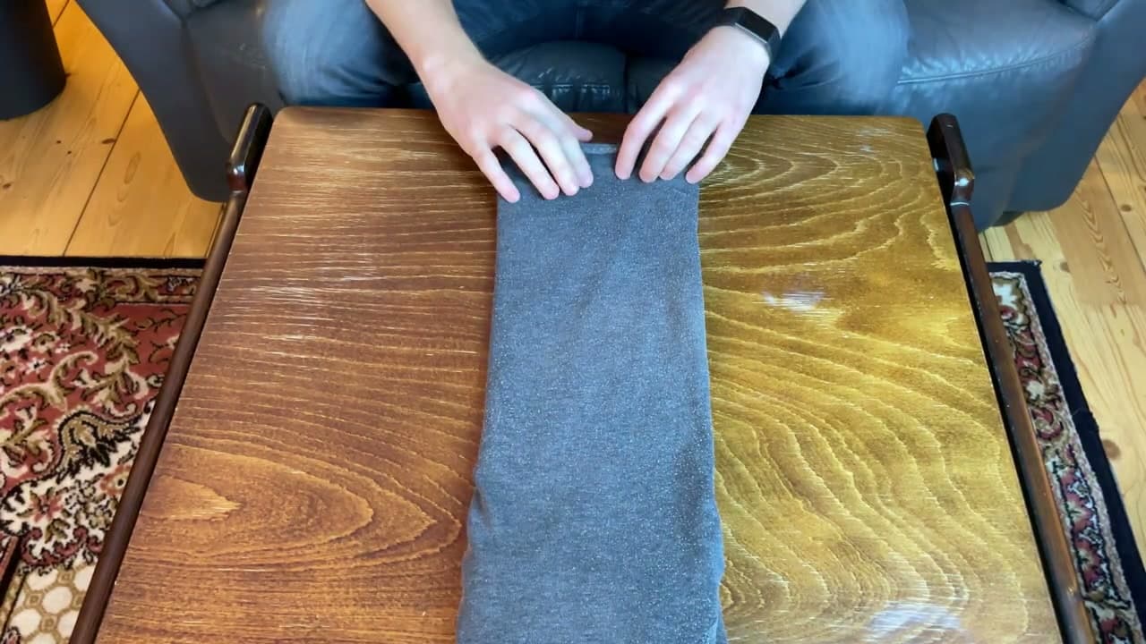 Step 3: Method 2: Set Up the Hoodie Face-Up and Fold the Sleeves Across