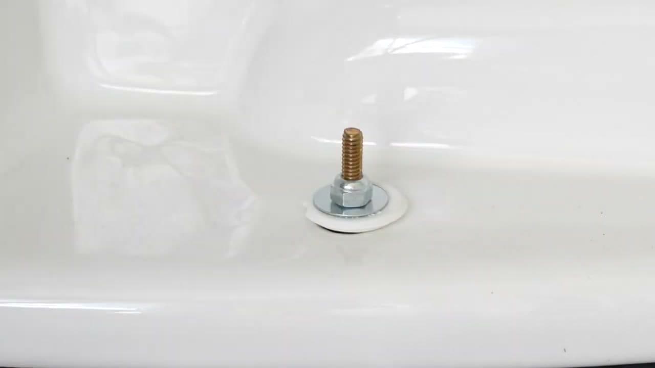 Step 5: Step 5: Lower the Toilet and Tighten the Bolts