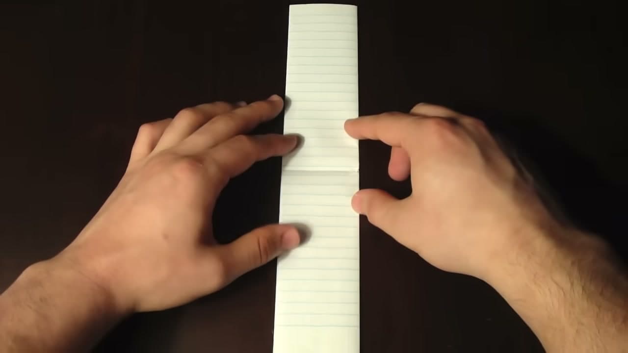Step 4: Keep Folding Until You Have a Narrow Strip - How to Make a Paper Football (Classic Triangle Fold)