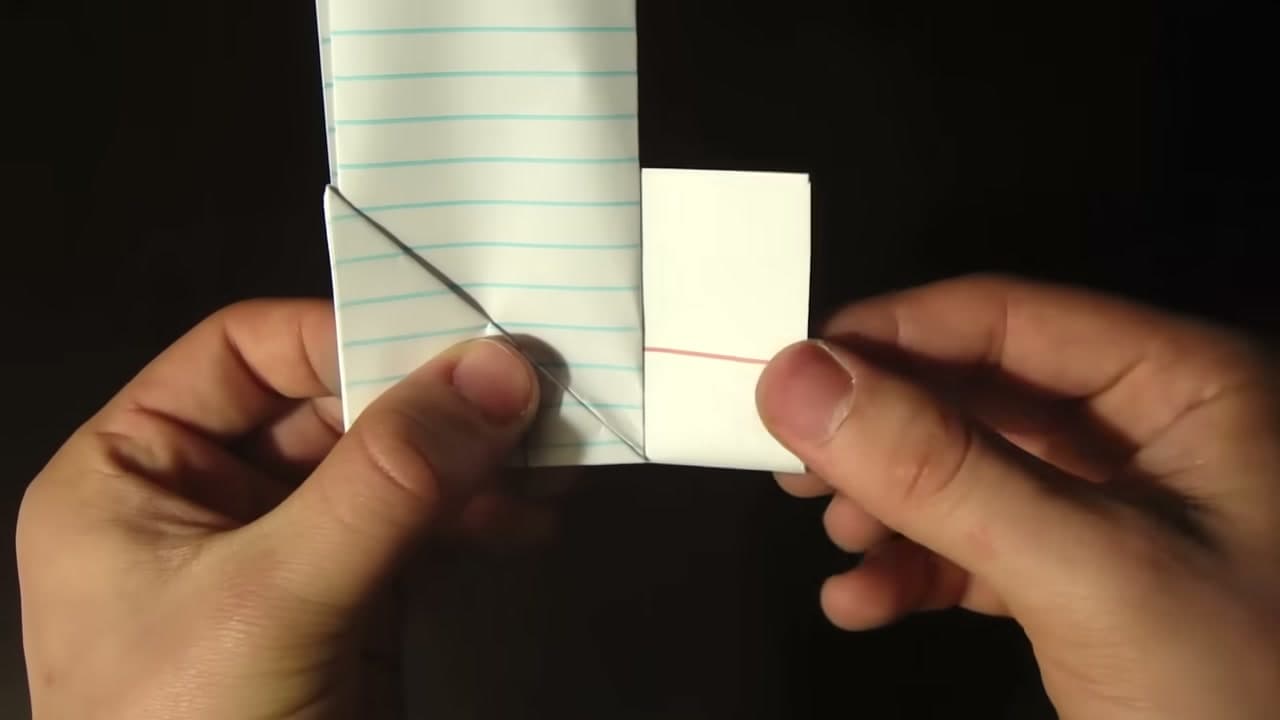 Step 5: Start the Triangle With a Corner Fold - How to Make a Paper Football (Classic Triangle Fold)