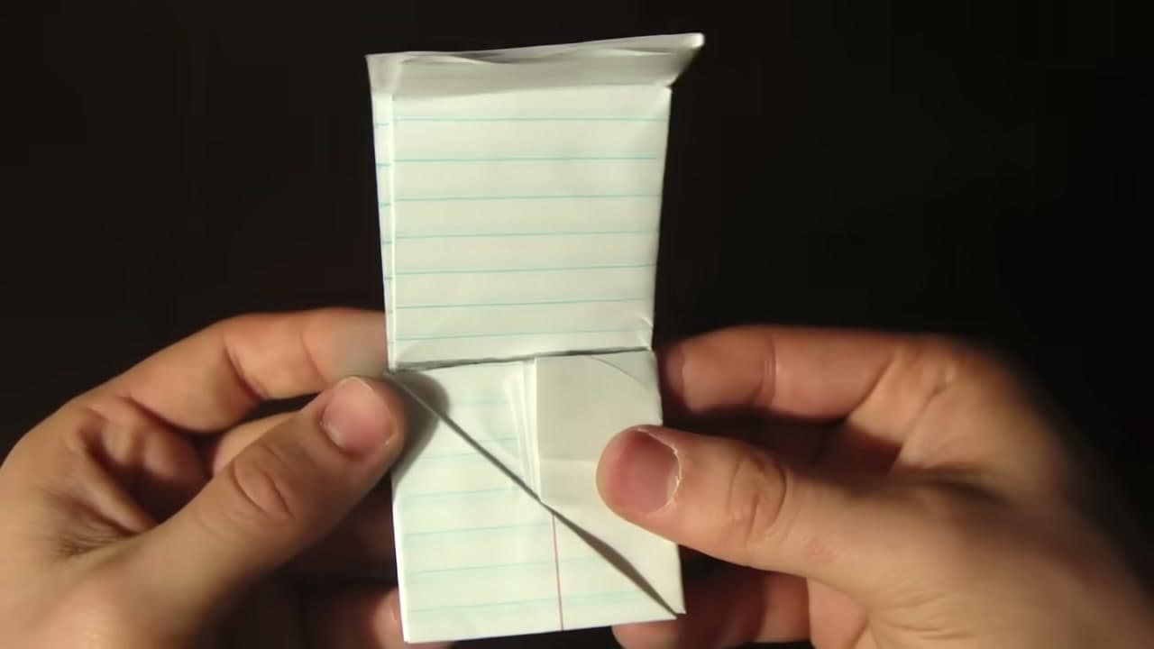 Step 6: Keep Flipping the Triangle Up the Strip - How to Make a Paper Football (Classic Triangle Fold)