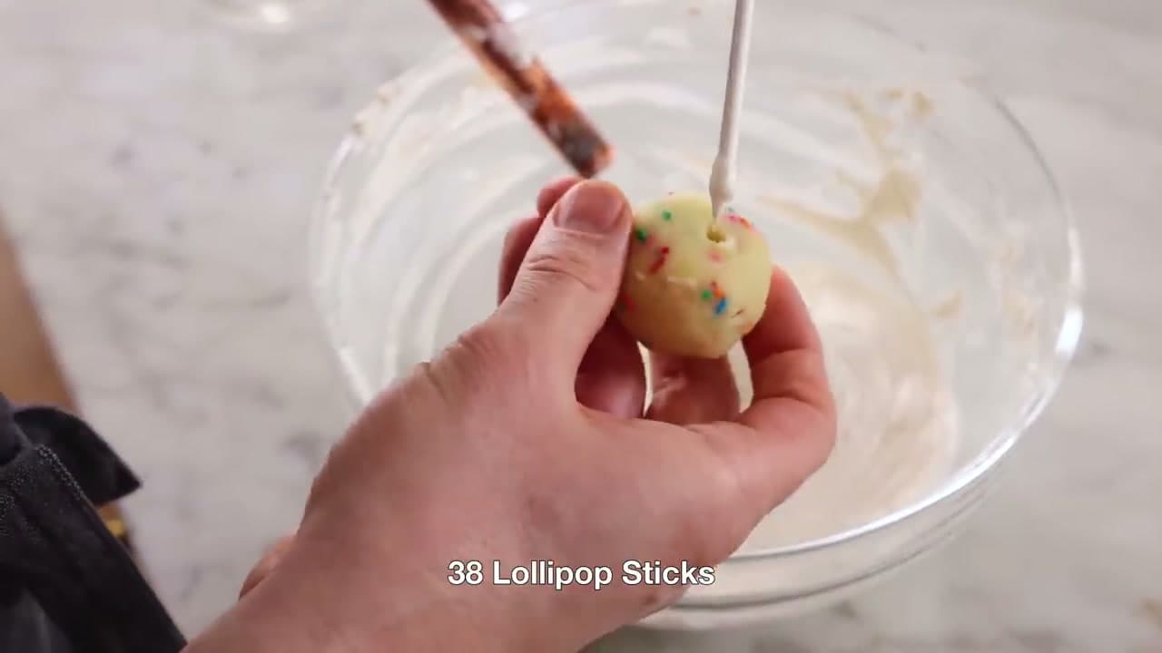 Step 8: Dip the Stick and Push It Into a Cake Ball - How to Make Cake Pops: Easy Step-by-Step Recipe