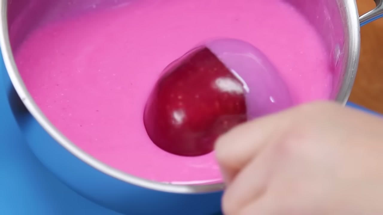 Step 6: Roll the Apple Through the Candy - How to Make Candy Apples