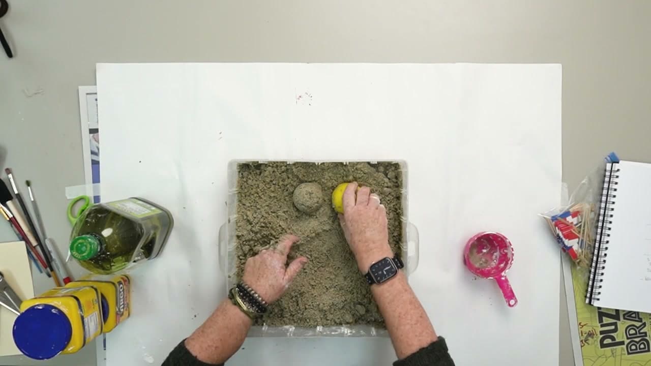 Step 8: Press a Cup into the Kinetic Sand to Mold a Dome - How to Make Kinetic Sand