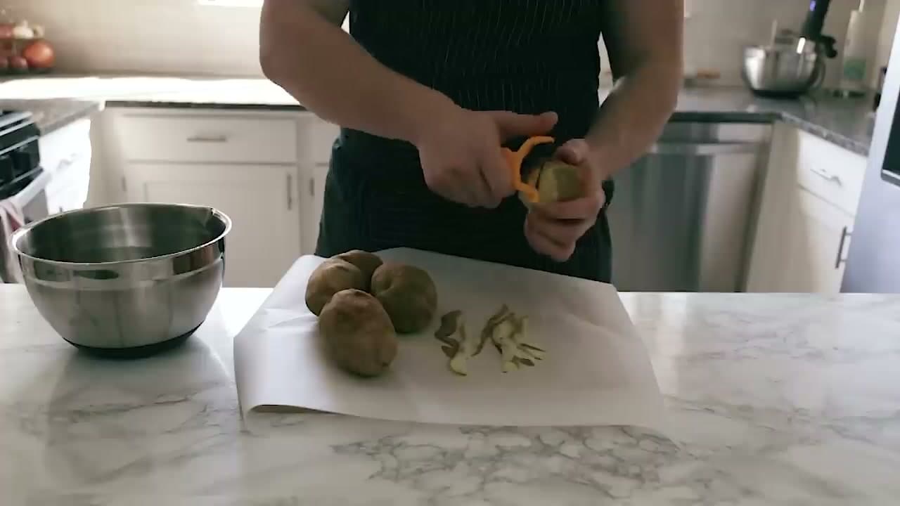 Step 3: Step 3: Peel Four Large Russet Potatoes Over Parchment