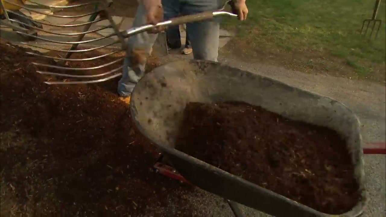 Step 4: Step 4: Use an ensilage fork to move new mulch