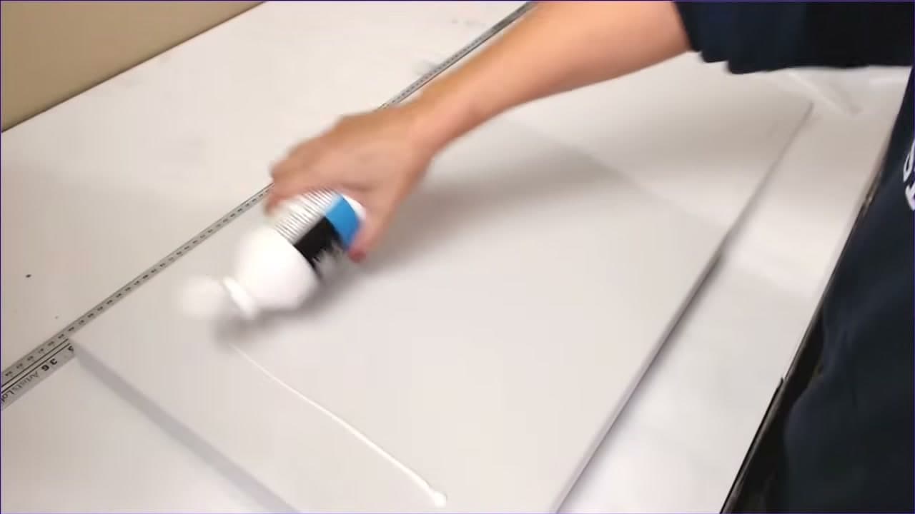 Step 2: Step 2: Pour the Gesso Across the Canvas