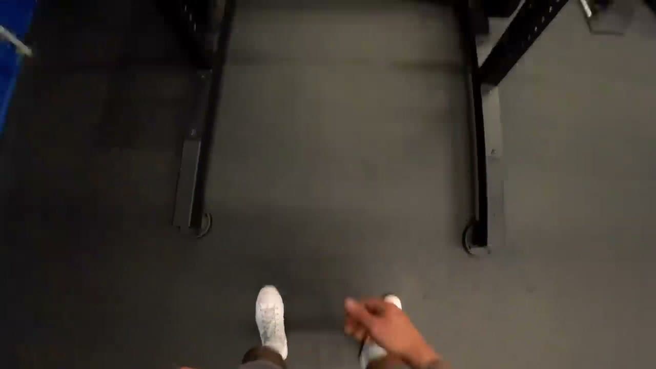 Step 2: Step 2: Position the Bar on Your Upper Back