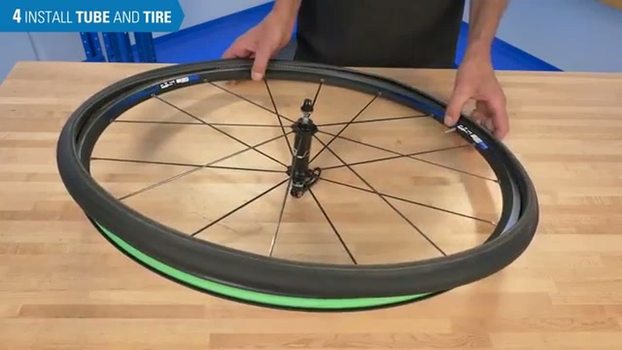 Step 7: Work the Tire Beads onto the Rim