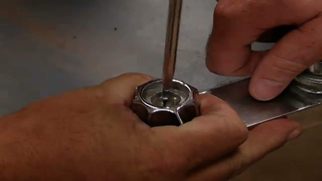 Step 1: Step 1: Pop the cap and back out the handle screw