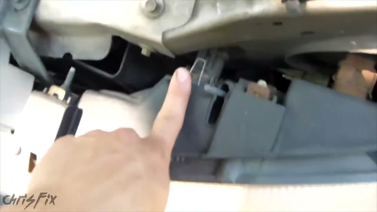 Step 2: Step 2: Open the hood and find the bulb housing