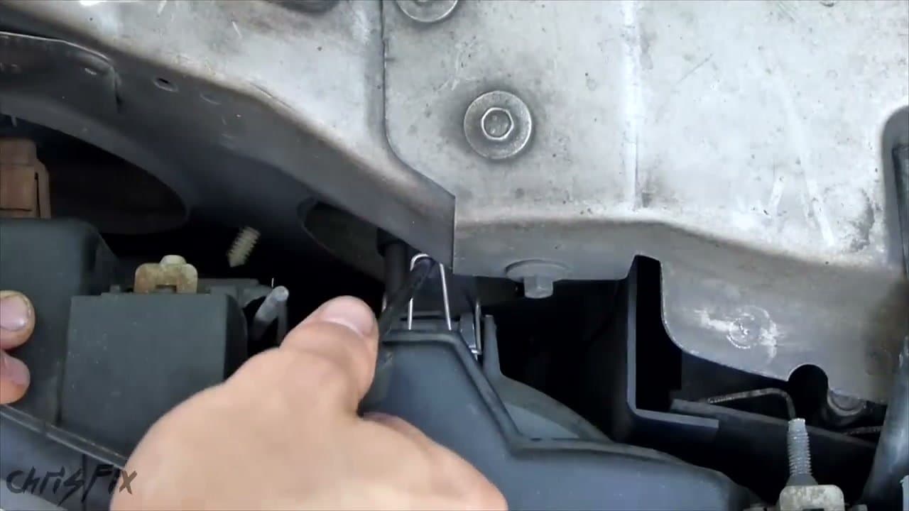 Step 3: Step 3: Pop the retaining clip on the back of the housing