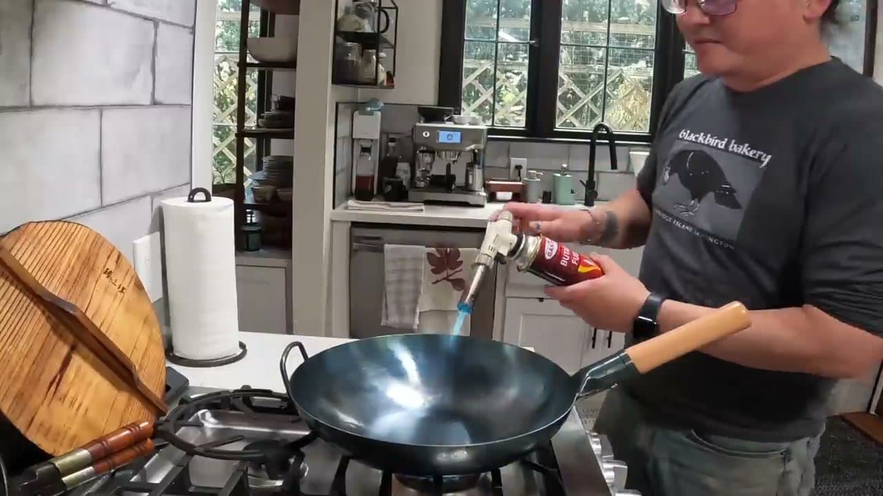 Step 1: Step 1: Heat the empty wok over high flame, tilting to expose every surface