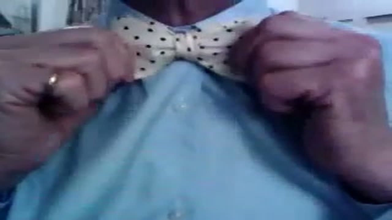 Step 8: Flip the Collar Down and Smooth the Tie Flat