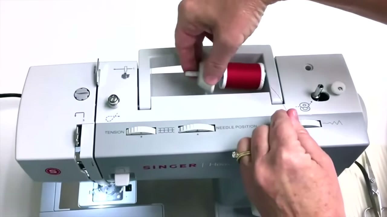 Step 1: Put the Spool on the Pin - How to Wind a Bobbin