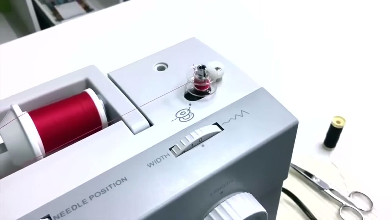 Step 7: Hold the Tail and Wind - How to Wind a Bobbin