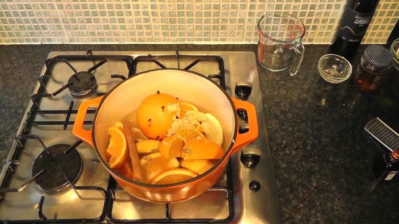 Step 4: Add the Cinnamon Stick, Grated Ginger and Nutmeg - How to Make Mulled Wine