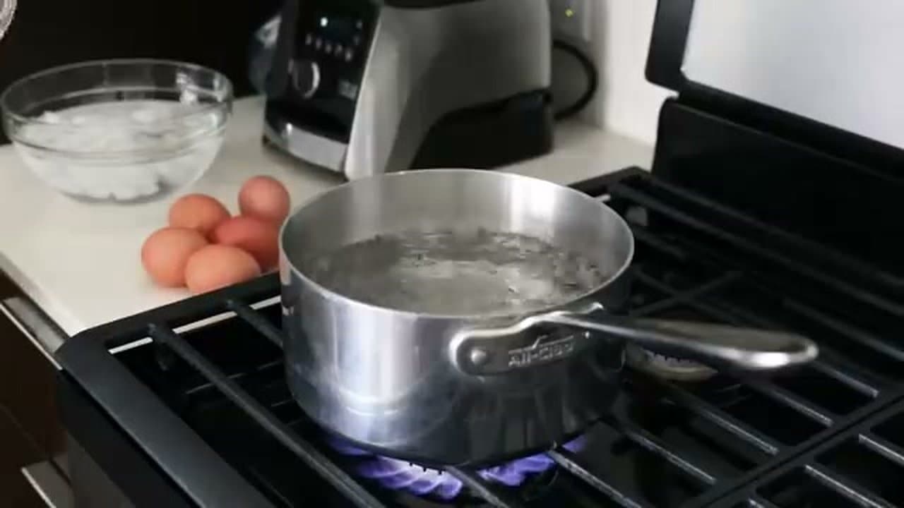 Step 3: Lower the Eggs into Boiling Water