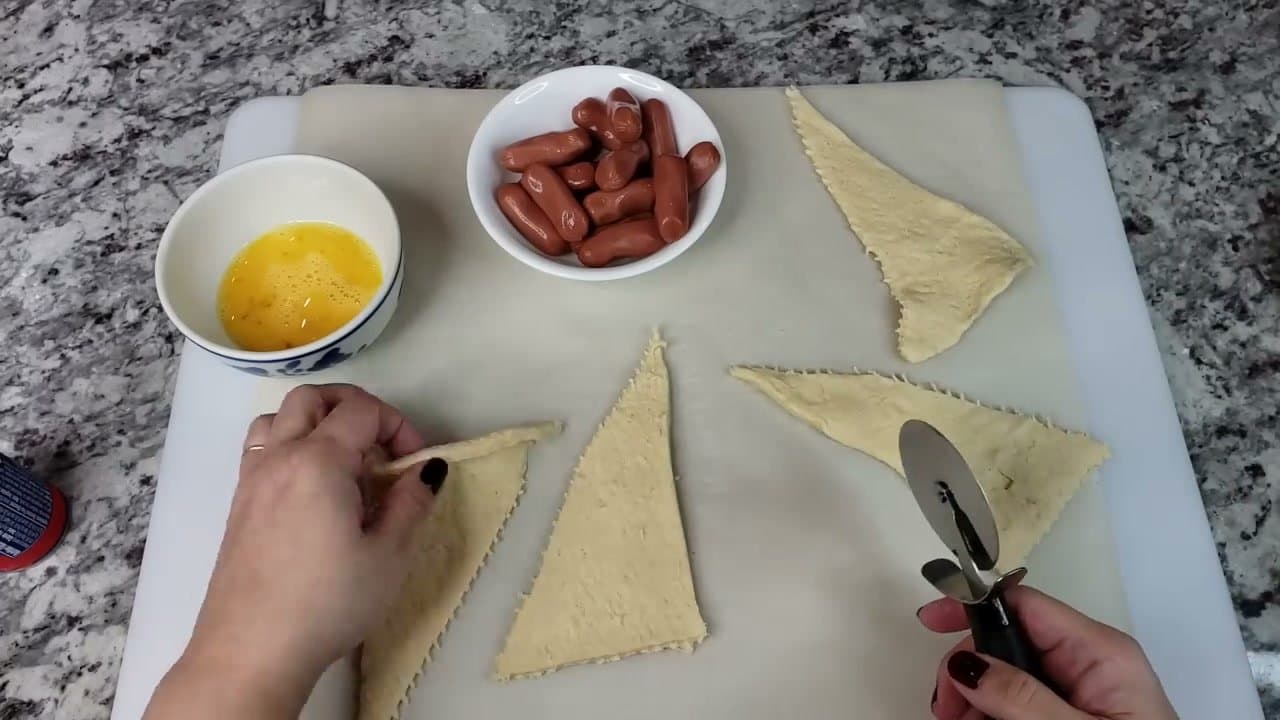 Step 2: Step 2: Cut each triangle into three thin strips