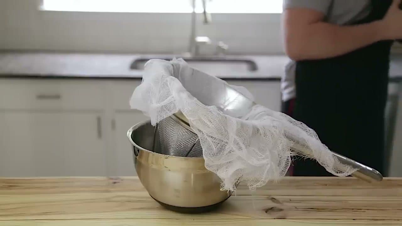 Step 6: Step 6: Strain through a fine mesh strainer lined with cheesecloth