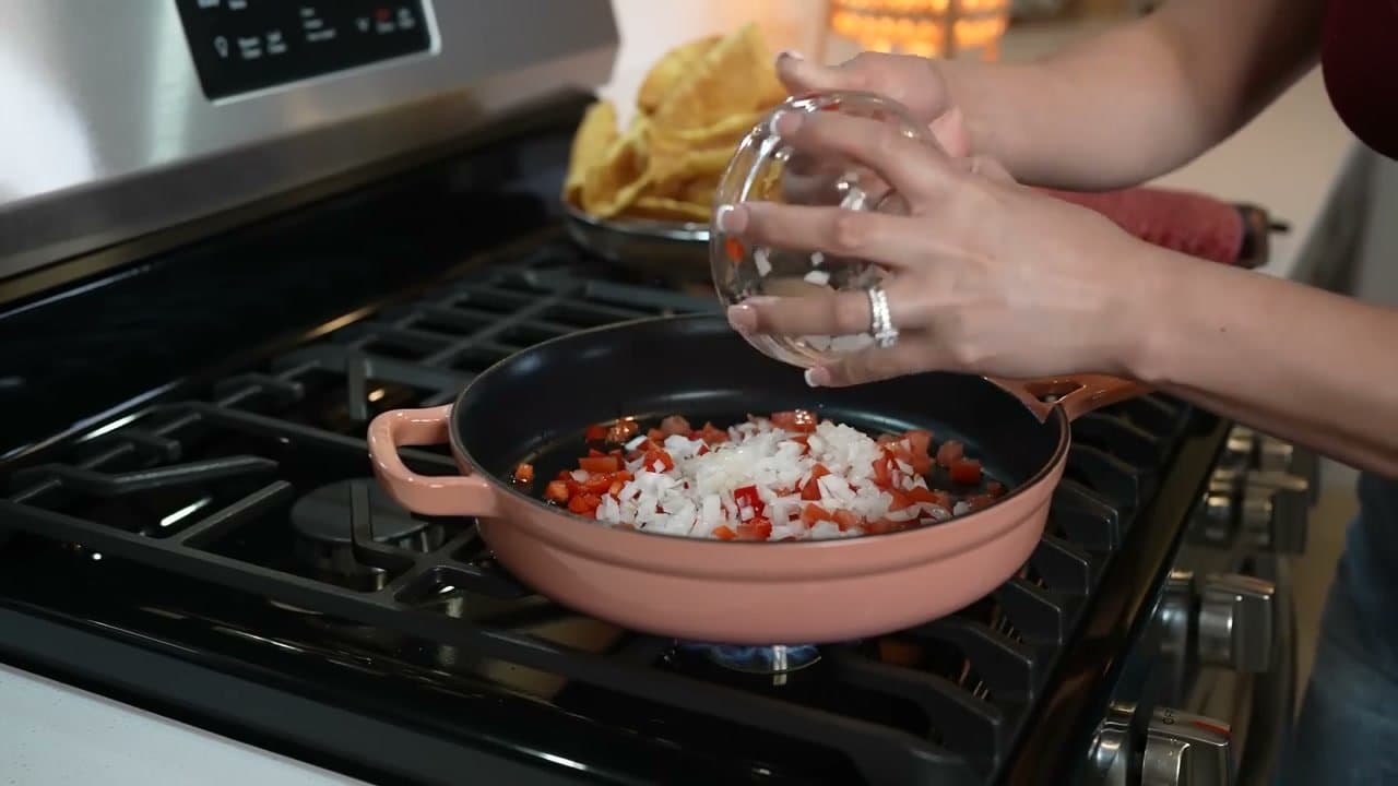 Step 3: Step 3: Saute the onion, tomato, and bell pepper