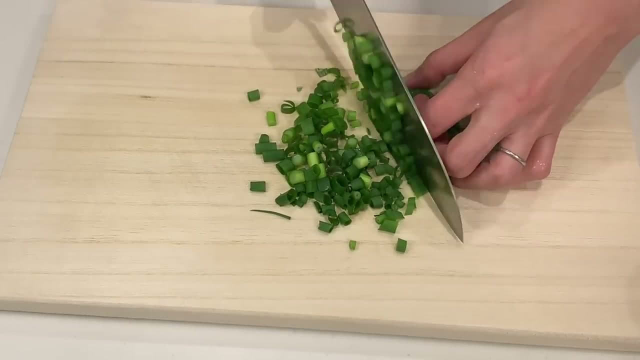 Step 2: Step 2: Finely Chop the Carrot, Garlic, and Green Onion