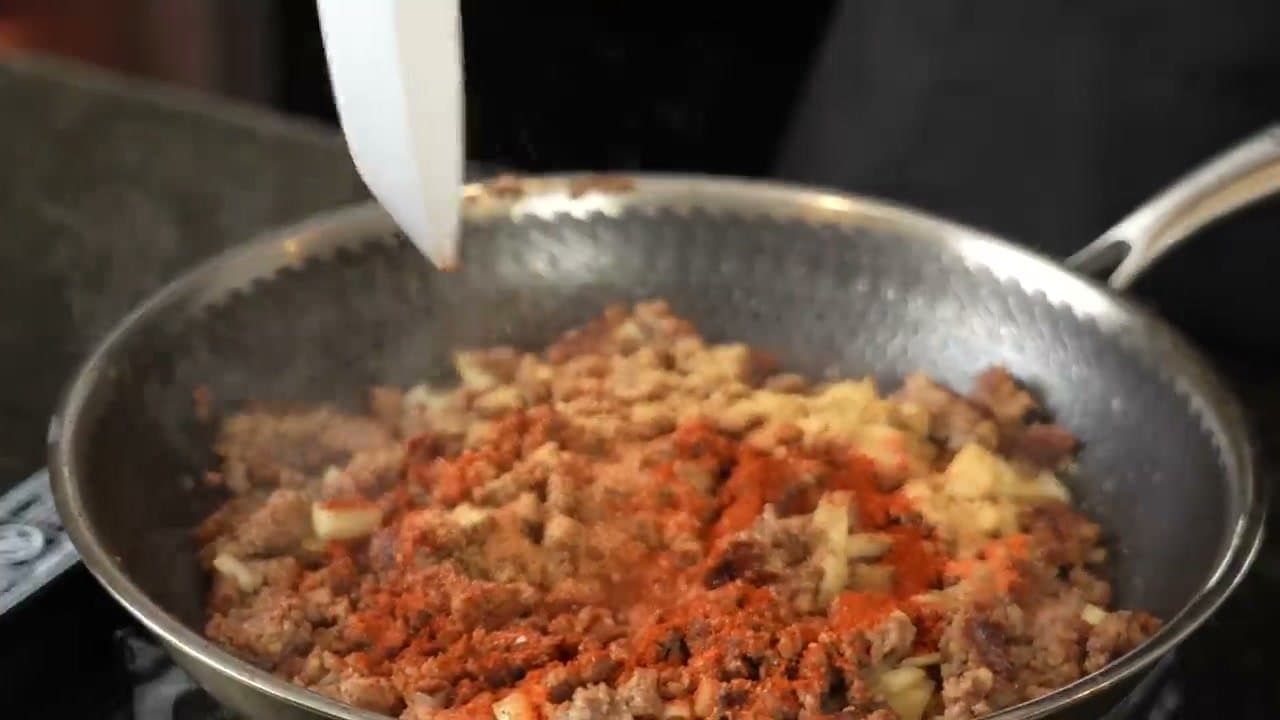 Step 4: Step 4: Add the onion and season the meat